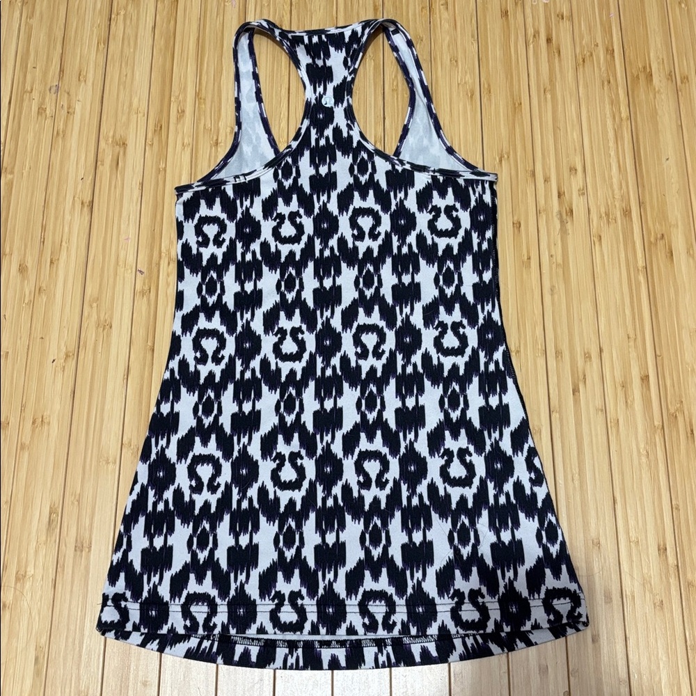 Lululemon tank top. No tag. Measures a size 4. White,black and purple. - Picture 2 of 7